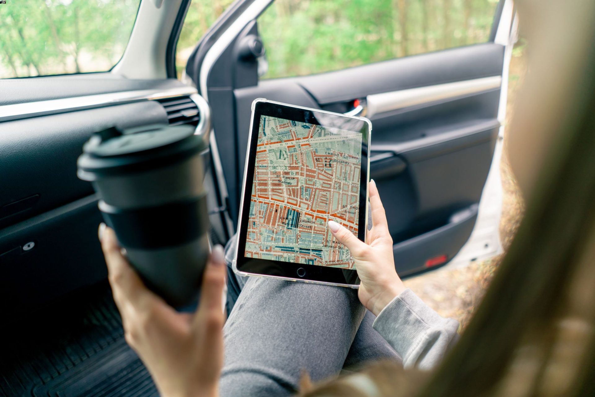 a-girl-sits-in-a-car-in-the-front-passenger-seat-a-2024-11-26-20-41-37-utc-1